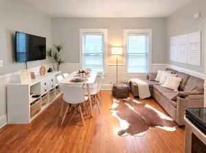 a living room with a couch and a table at Luxe 3BR Apartment at MIT Harvard with FREE parking in Cambridge