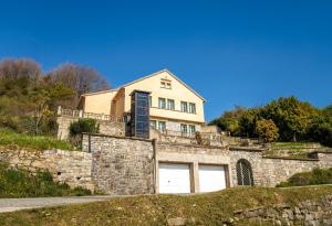 a house on top of a stone wall at Juliette in Venaco