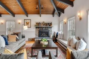 a living room with a couch and a fireplace at Red Clover Inn in Mendon +136 photos