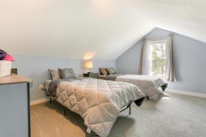 a bedroom with two beds and a window at Waterfront Wallkill Duplex Home w/ Fire Pits! in Wallkill