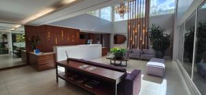 a living room with a couch and a table at Hotel Alvorada in Concordia