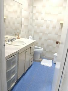 a bathroom with a sink and a toilet and a mirror at Hostal Dream House in San Andrés +19 photos