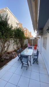 a table and chairs sitting on a patio at SunWave Chott Meriem in Sousse