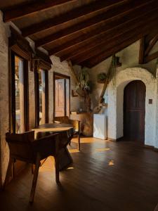 a room with a ping pong table in a building at Antu Wellness cabaña de lujo en paine in Maipo