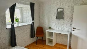 a room with a desk and a chair and a window at Nomads Village in Bled +34 photos