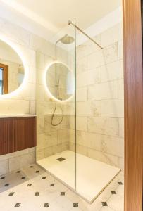 a shower with a glass door in a bathroom at Juliette in Venaco