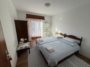 a bedroom with a large bed and a window at La Pergola in Auressio