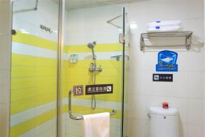 a bathroom with a shower and a toilet at 7Days Premium Beijing Garden Expo Park in Beijing