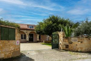 a house with a gate in front of it at Maleme Maisonette in Maleme