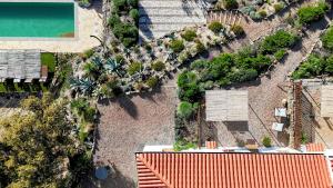an overhead view of a house with a swimming pool at Finca Bravo in Cortegana