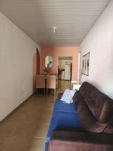 a living room with a couch and a table at Raízes do Sertão - Vale do Catimbau in Buíque