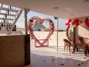a heart shaped arch in the middle of a room at Ramses Pyramids INN in Cairo