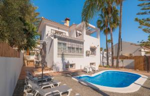 an exterior view of a house with a swimming pool at Coliving Torremolinos Casa privada in Torremolinos