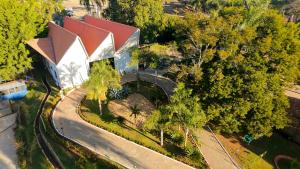 an overhead view of a white building with a red roof at Village Resort All Fun Inclusive in Jaboticatubas