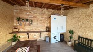 a kitchen with a washer and dryer in a room at Casa Berlenga in Peniche