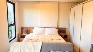 a bedroom with a large bed with two night stands at Civis Jardinia Studio 1B Pool & Sauna in Luque +18 photos