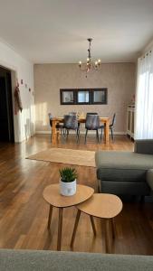 a living room with a couch and a table at S'heimet Hüüs in Colmar