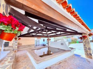 a patio with a pool in the middle of a building at Villabett Caudiel está de moda in Caudiel