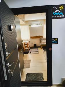 an open door to a room with a living room at Студио Нико - Царево in Tsarevo