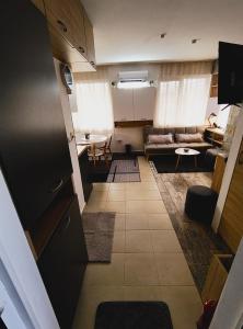 a living room with a couch and a table at Студио Нико - Царево in Tsarevo