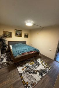 a bedroom with a bed and a rug at Minimalist luxury room in Zgornje Hoče