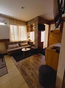 a living room with a couch and a table at Студио Нико - Царево in Tsarevo +57 photos