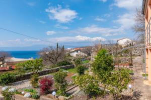 a view of a garden from a building at Apartment Tena in Kraljevica