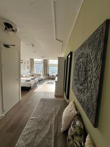 a bedroom with a bed and a living room at Job Baster Kraanplein - Het Zonnehof in Zierikzee