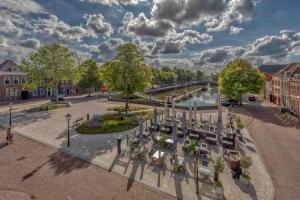an aerial view of a park with trees and a river at Job Baster Kraanplein - Het Zonnehof in Zierikzee