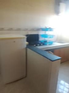a kitchen with a stove and a blue counter top at Premium Services in Tatta +10 photos