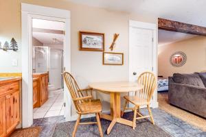 a kitchen and dining room with a table and chairs at Big Sky Ski Condo in Big Sky +17 photos
