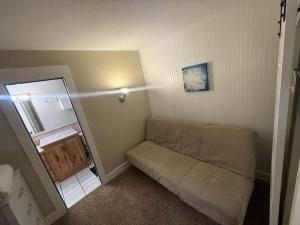 a small room with a couch in the corner at Big Sky Ski Condo in Big Sky