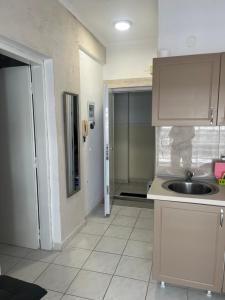 a kitchen with a sink and a counter top at Megalou Alexandrou in Nea Moudania +2 photos