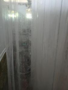 a view of a room through a window with curtains at Cocoa Cabana in Scarborough +40 photos