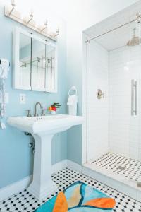 a bathroom with a sink and a shower at The Provincetown Hotel at Gabriel's in Provincetown +157 photos