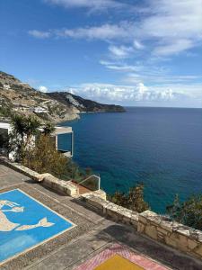 a house with a view of the ocean at Zen Townhouse - Infinity Seaview in Palaiokastro