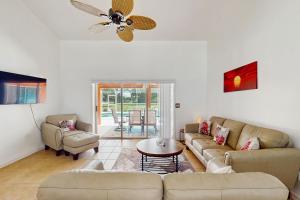 a living room with a couch and a table at Sebastian Serenity in Sebastian
