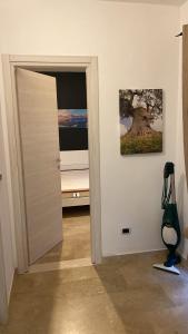 a room with a door leading to a bedroom at Near Sea in Monopoli +7 photos