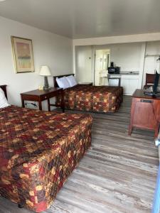 a hotel room with two beds and a kitchen at Point 1 Resort & Motel in Westerly