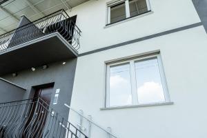 a building with stairs and a window at Silvia's Luxury Suites by RentMax in Canegrate