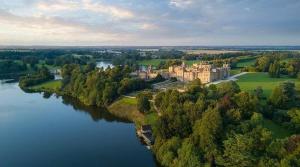 an aerial view of a castle next to a river at New,London Hideaway Studio in Woking