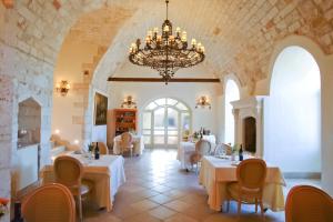 a large room with tables and chairs in it at Relais Sant'Eligio in Ostuni