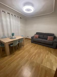 a living room with a couch and a table at Piso Turístico Navarrete in Navarrete +16 photos