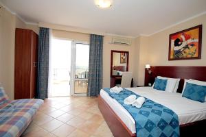 Säng eller sängar i ett rum på Apartments Villa Mare Mar