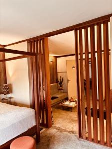 a bedroom with a bed and a living room at Boutique Hotel Casa Teatro in Manaus +31 photos