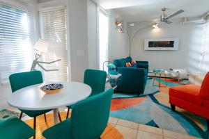 a living room with a table and chairs at The Provincetown Hotel at Gabriel's in Provincetown