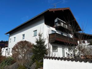 a white building with a balcony on top of it at Privathaus Sieglinde in Sondermoning