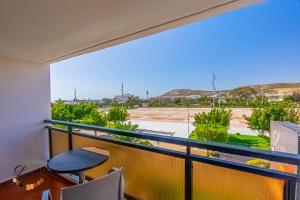 a balcony with a desk and a table at Hôtel Résidence Louban in Agadir