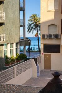 a view of the ocean from the balcony of a building at Suites Prieto Fuengirola Centro in Fuengirola
