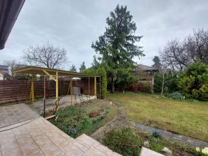 a garden with a gazebo in a yard at Balaton Breeze Retreat in Balatonfüred